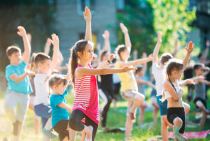 kids doing yoga outside